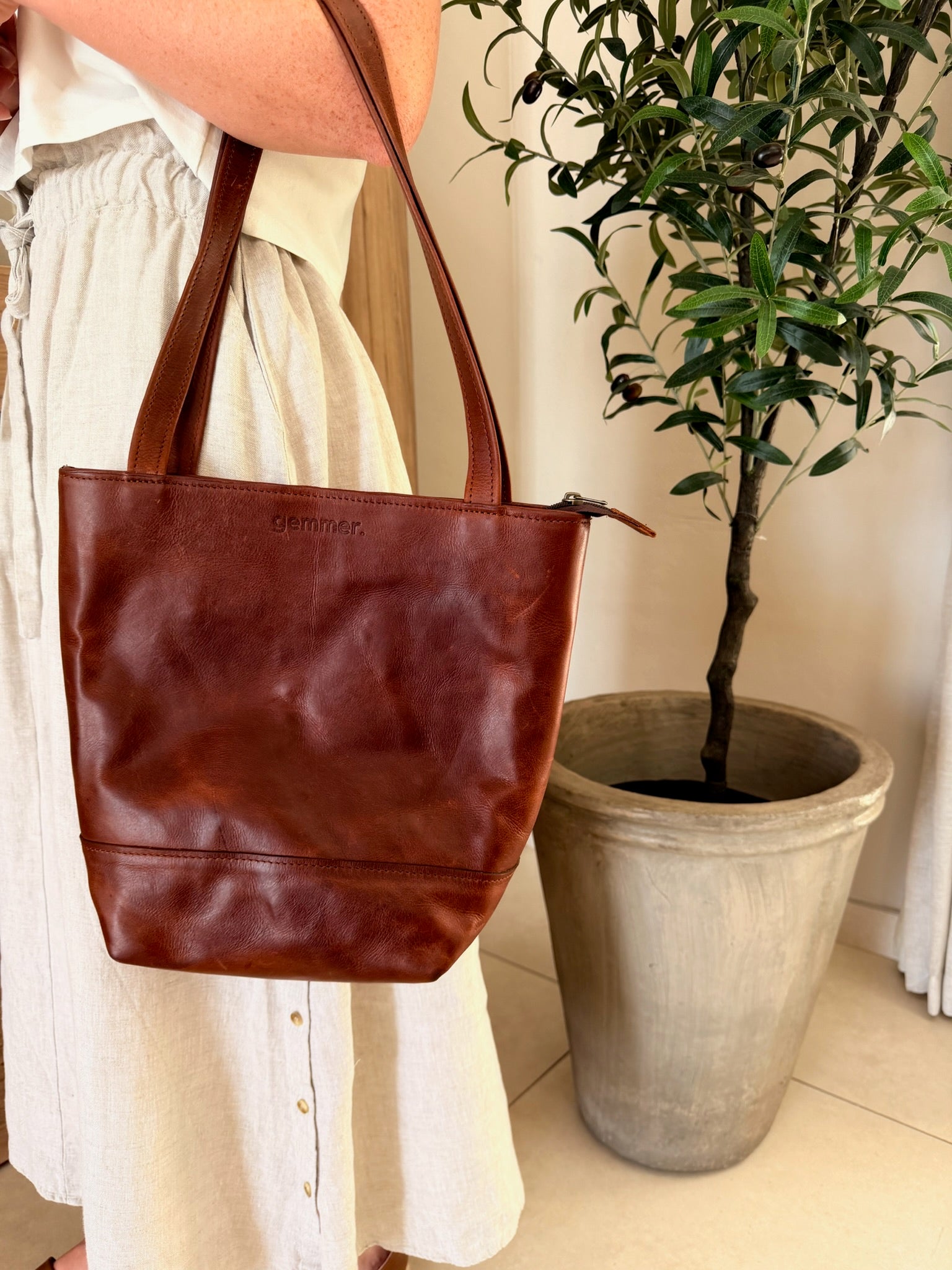 Small Tote Bag – Lifestyle Photo – Lady Carrying Tobacco Leather Bag