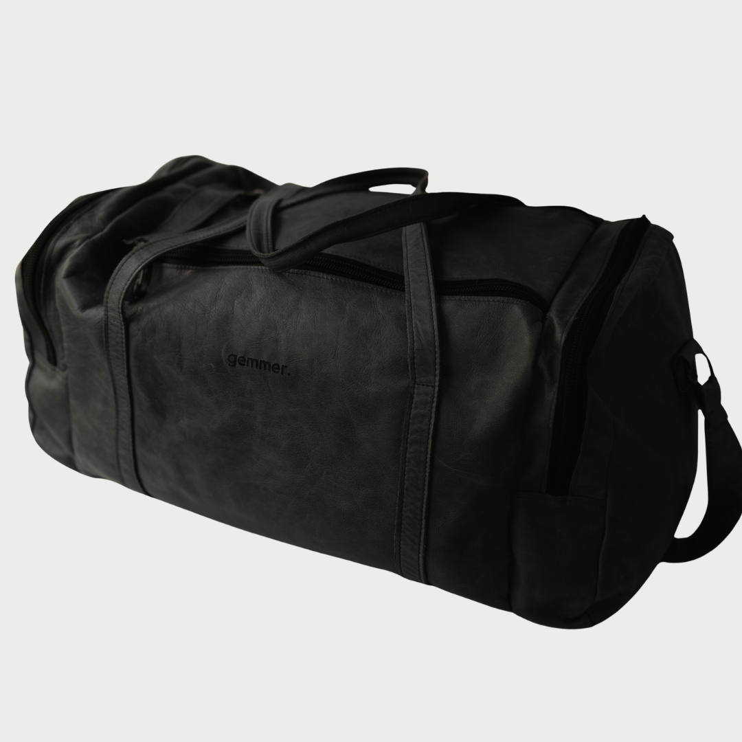 TRVL Duffel Bag Large – Side View – Black Leather Bag