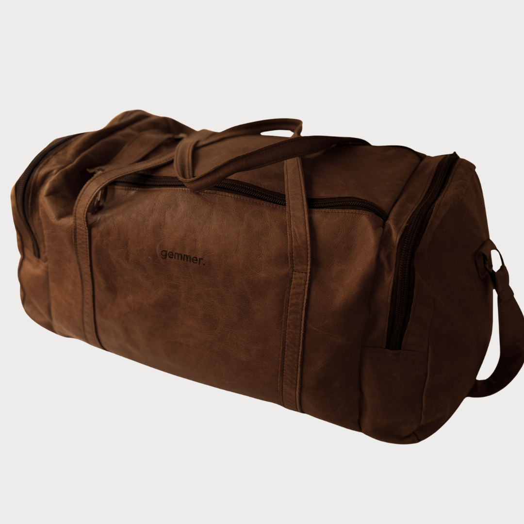 TRVL Duffel Bag Large – Side View – Brown Leather Bag